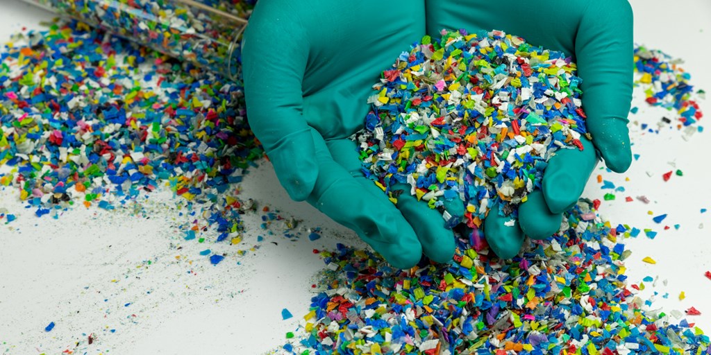 A handful of plastic resin pellets for plastic injection molding