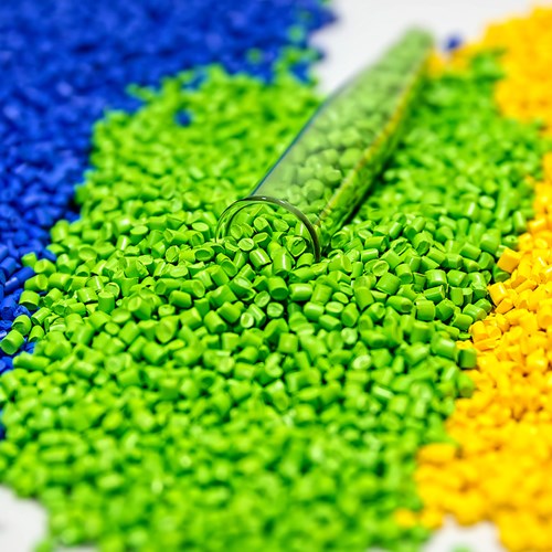 Three piles of polymers to be melted and used for plastic injection molding
