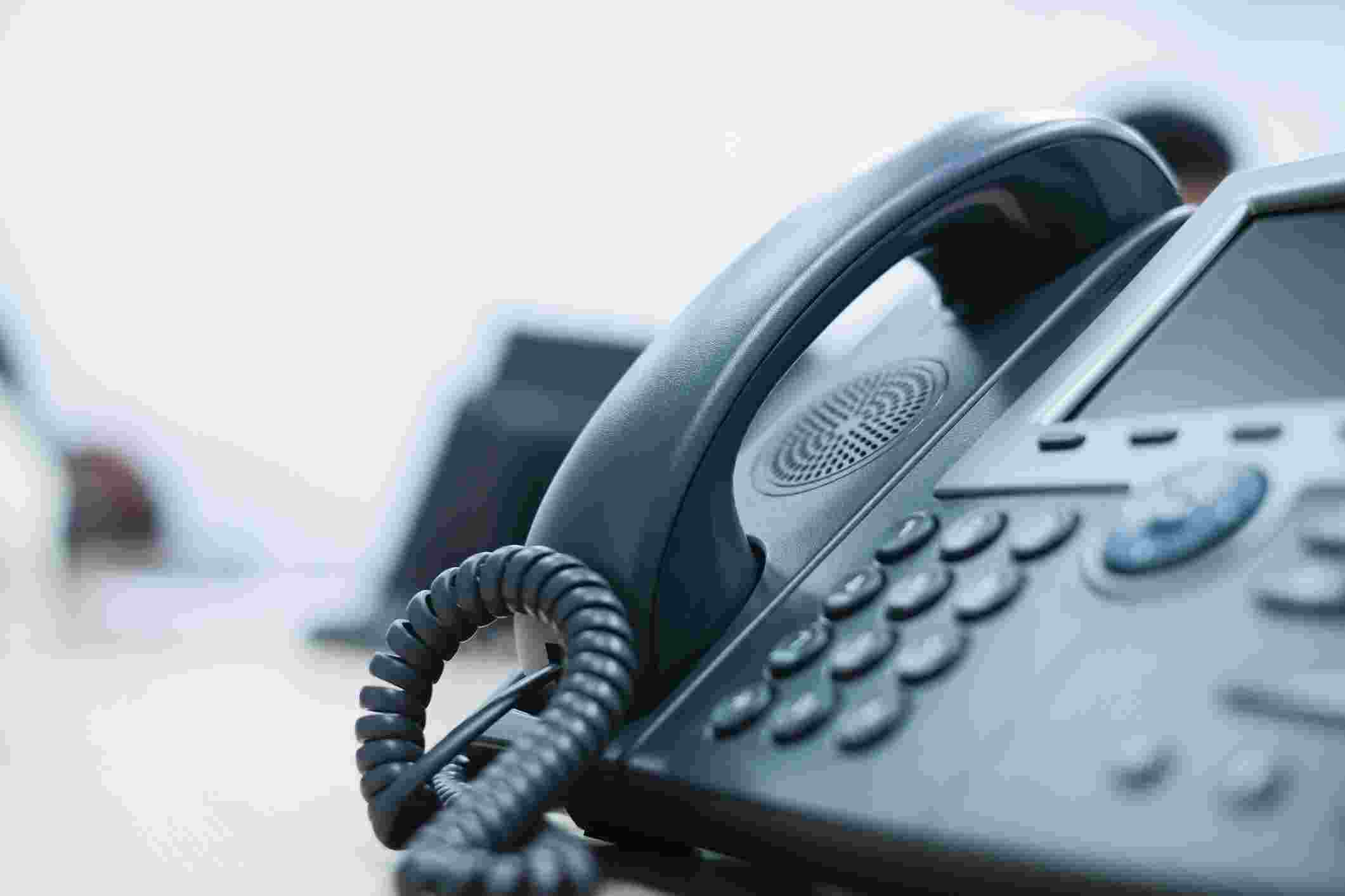 An office telephone on a desk 